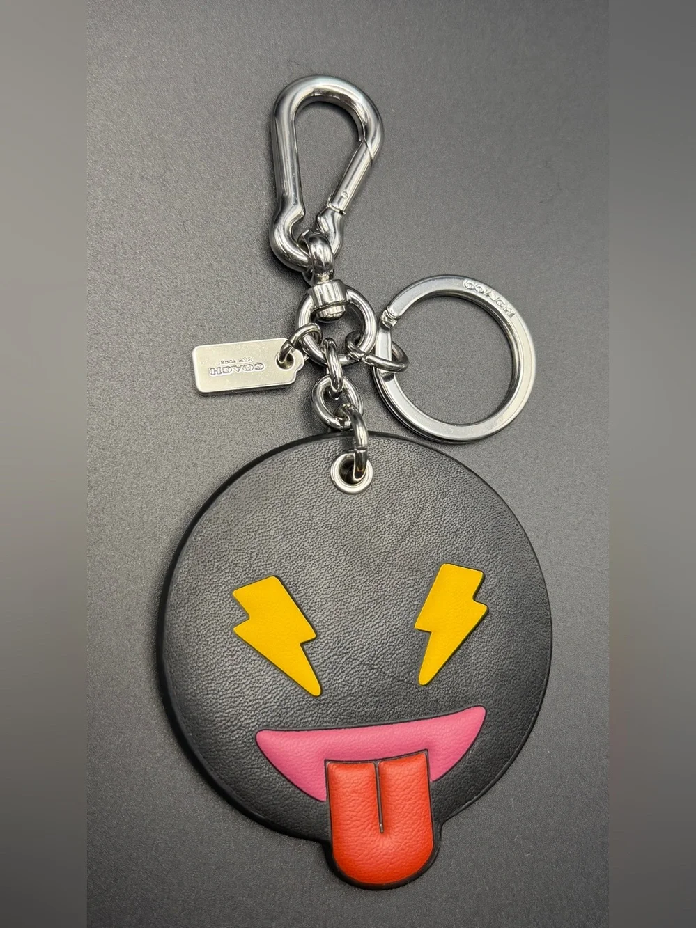 Coach Black Leather Emoji Keychain with Yellow Lightning Eyes & Red Tongue